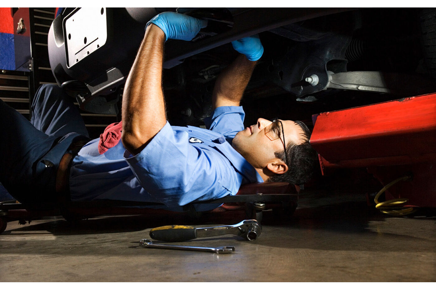 The Clark Drive shop: garage door open, daylight crossing the floor, work bay in view